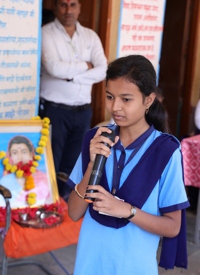 Gayatri speaking on mic